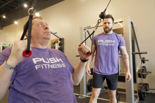Brian Hill/bhill@dailyherald.comFittest Loser participant Rick Meyers with trainer Patrick Stille